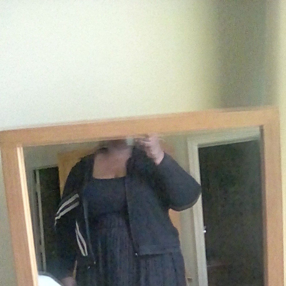 Black athletic jacket with white stripe.